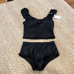 Black women's two piece swimsuit. Brand New polyester quick drying small size.